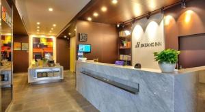 a lobby of a pharmacy with a counter in a store at Jinjiang Inn Style Xiangshan Bus Station in Xiangshan