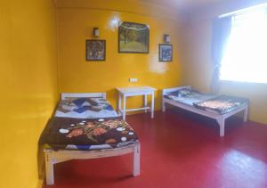 Postel nebo postele na pokoji v ubytování D Cloud Guesthouse