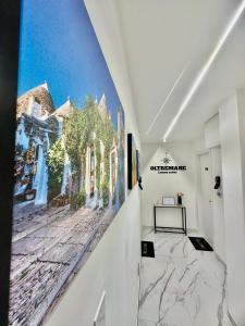 a hallway with a painting on the wall at Oltremare Luxury Suites in Bari