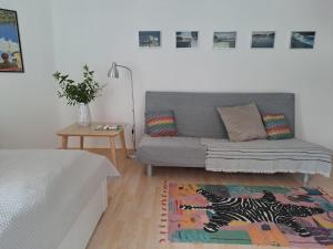 a living room with a couch and a rug at Ferienwohnung Seeblick in Lindau