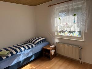 Ένα ή περισσότερα κρεβάτια σε δωμάτιο στο Hagemann Querfurter Straße 13