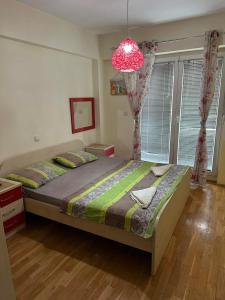 Ένα ή περισσότερα κρεβάτια σε δωμάτιο στο Apartman Centar