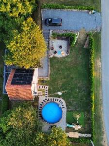 an aerial view of a yard with a swimming pool at Tri Tresnje & Three Cherries in Grabovnica