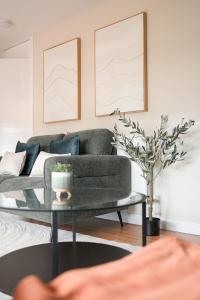 a living room with a couch and a table at Beechgrove House in Uphall