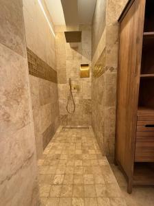 a bathroom with a walk in shower and a walk in shower at L'orée du bois - Contis - Ocean and Spa in Saint-Julien-en-Born +22 photos