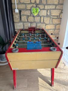 a foosball table with avertisement for at Beau Studio in Gouvieux