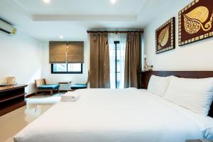 Postel nebo postele na pokoji v ubytování YON INN - Sukhumvit 4 BTS NANA