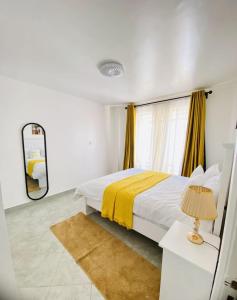 Ένα ή περισσότερα κρεβάτια σε δωμάτιο στο 2Bedroom at Thindigua Kiambu road