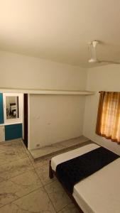 a bedroom with a bed in a room at Dolmens castle in Marayoor