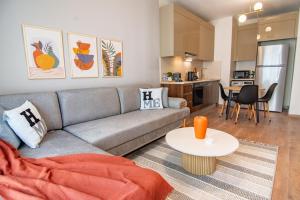 a living room with a couch and a table at Cozy Modern & Stylish 1br Apartment in Istanbul