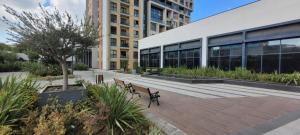 a couple of benches in front of a building at Cozy Modern & Stylish 1br Apartment in Istanbul