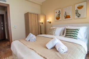 a bedroom with two beds with white sheets and pillows at Cozy Modern & Stylish 1br Apartment in Istanbul +30 photos