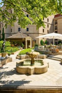 a fountain in a courtyard in front of a building at The Westin Grand Berlin in Berlin