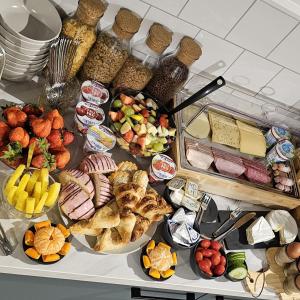 a refrigerator filled with lots of different types of food at B&B Het Groene Hart in Nieuwkoop