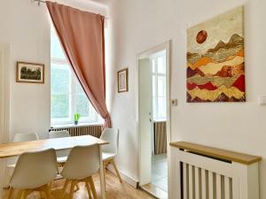 a dining room with a table and chairs at 2-Bedroom Stylish Apartment with Free Parking in Vienna