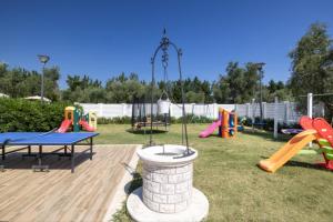 a playground with a table and some slides at Semi detached Villa Country in Lupetto