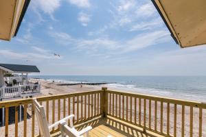 a view of the beach from the balcony of a beach house at Sulla Sabbia in Edisto Island