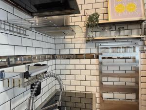 a kitchen with a sink and a faucet at Le Corsaire in Angers