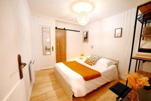 Ένα ή περισσότερα κρεβάτια σε δωμάτιο στο Le petit cocon