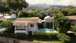 a house with a swimming pool in the yard at Luang Prabang View Hotel in Luang Prabang