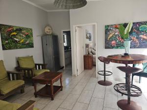 a living room with a table and chairs at Valley Cottage in Kenton on Sea