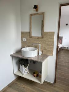 a bathroom with a sink and a mirror at Country Life  +34 photos