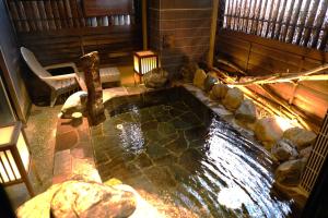an overhead view of a pond in a house at Dormy Inn Higashi Muroran in Muroran
