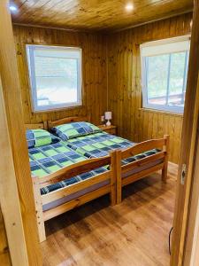 Postel nebo postele na pokoji v ubytování Tenisz vendégház