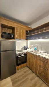Kuchyň nebo kuchyňský kout v ubytování Sunshore Center apartment #1 + 11 fotografií