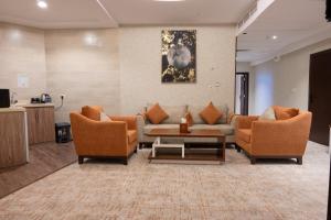 O zonă de relaxare la أجنحة أفق الفندقيه-Al Afaq Suites +45 fotografii