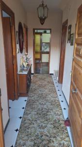 a hallway of a home with a tile floor at Casa de Pueblo con Encanto in Valderrubio