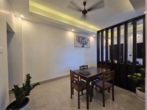 a dining room with a table and two chairs at Lir-etso Homestay in Diphu