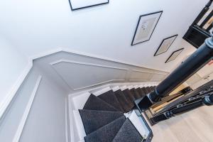 a stairwell with a glass case and a spiral staircase at Luxury 3Bed Apartment York Centre Sleeps 6 in York