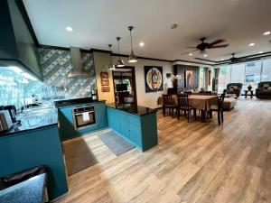 a kitchen and dining room with a dining table at Karon Beach Seaview Penthouse With Private Pool Condominium in Karon Beach