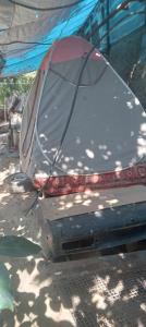 a car with an umbrella on the back of it at Mrganush kamp in Meghri +4 photos