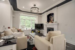 a living room with chairs and a fireplace at Spacious Family Home in Vancouver in Vancouver