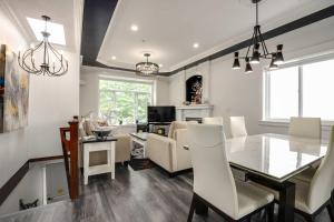 a dining room and living room with a table and chairs at Spacious Family Home in Vancouver in Vancouver +20 photos