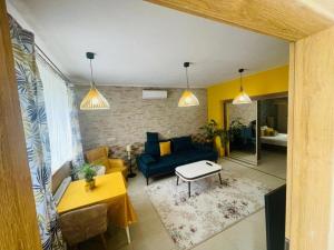 a living room with a couch and a table at Luxury Apartments in Wrocław