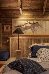 a bedroom with a bed with a lamp in it at Villa in Ahangama +1 photo