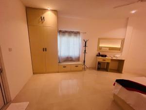 a room with a closet and a desk with a mirror at Vilu Himmafushi in Himmafushi +110 photos