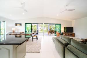a living room with a couch and a table at Beachside on Pacific in Mission Beach