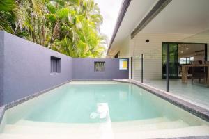 a swimming pool in the middle of a house at Beachside on Pacific in Mission Beach