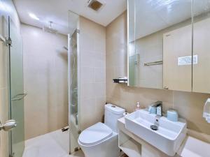 a bathroom with a toilet and a sink and a mirror at PƠ Homestay THESONG Vũng Tàu in Vung Tau +60 photos