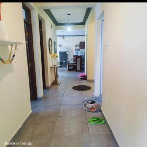 a hallway of a house with a floor with a floorngth at LES INTERNATIONAL in Mombasa