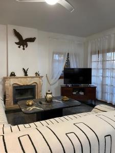a living room with a couch and a fireplace at Villa En Mijas Con Vistas Al Mar in Mijas