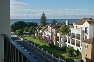 a row of houses on a street next to the ocean at Canela Park by Ĥ - Playa Isla Canela ICHP34P3 in Isla Canela