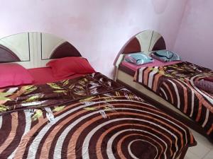 En eller flere senge i et værelse på Mary Cottage