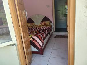 En eller flere senge i et værelse på Mary Cottage