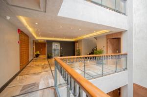 a view of a hallway with a balcony at The Passport Hotel in Assagao