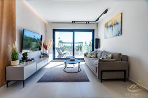 a living room with a couch and a table at Higuericas Views in El Mojón